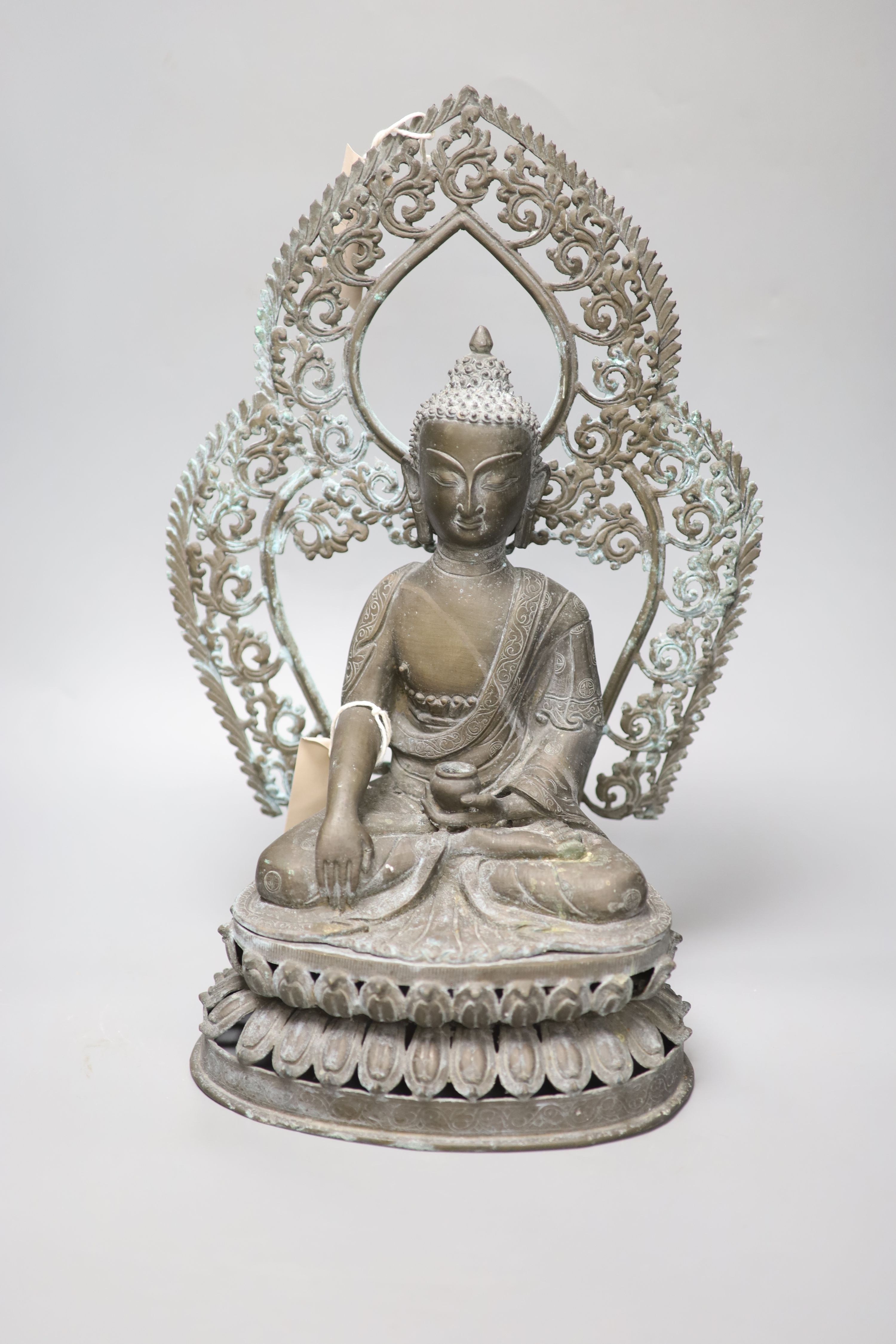 A Nepalese bronze Buddha, overall height 44cm